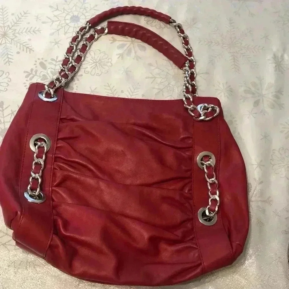 Desmo red leather shoulder bag with silver link hardware.